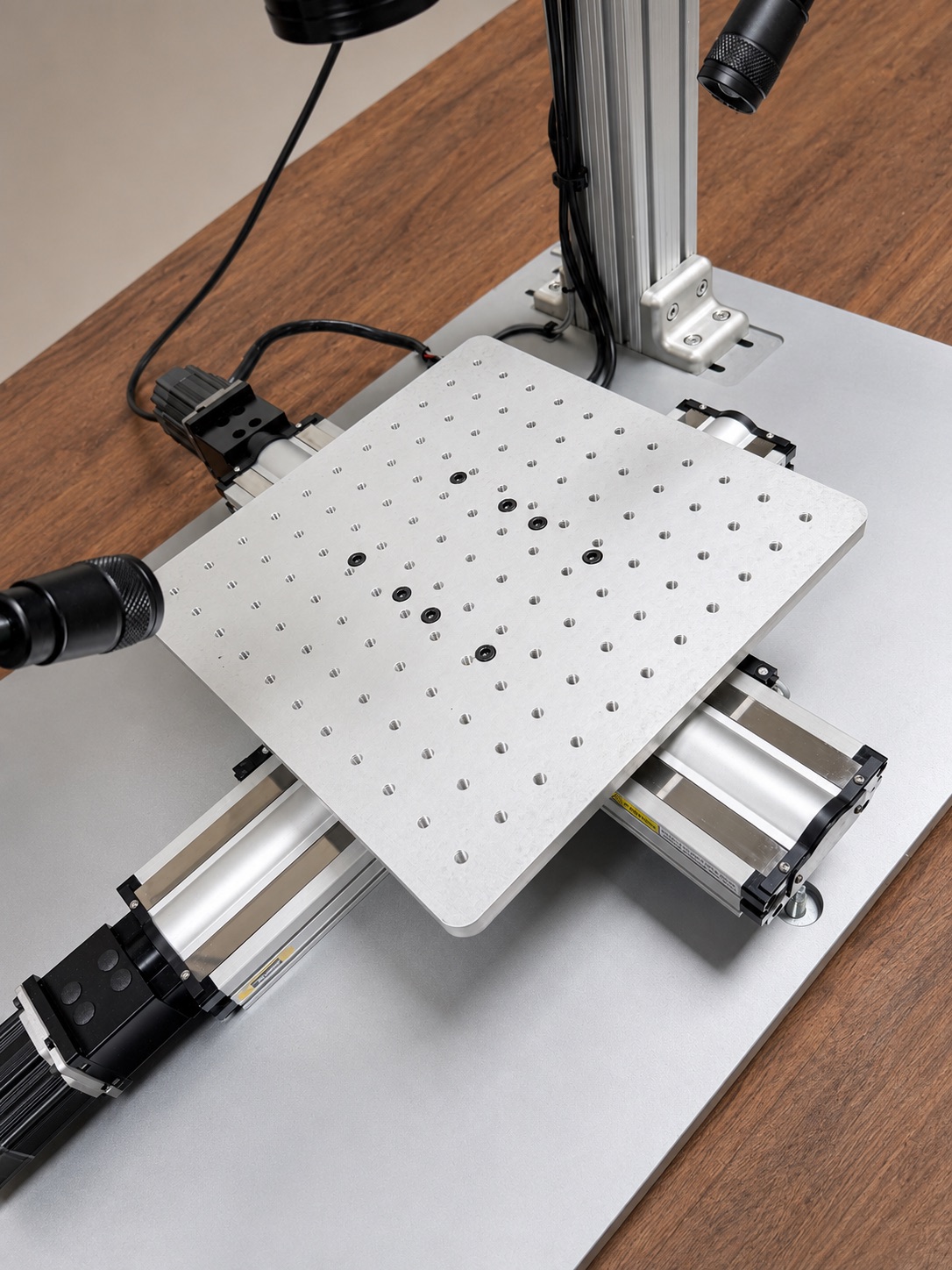 Detail of the WeldStation motion table, tooling plate, and laser head